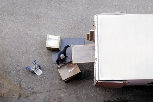 Furniture and boxes being loaded into a van for an Acton move