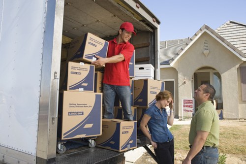 Careful loading of household furniture for an Acton relocation