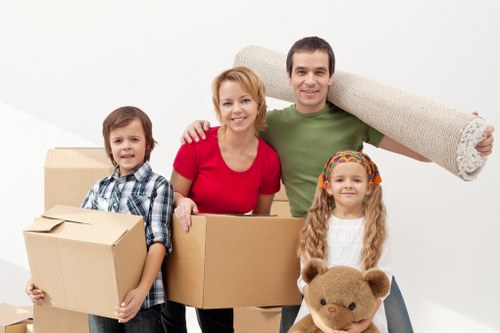 Packed boxes and furniture ready for urgent relocation
