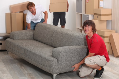 Team using protective measures inside a property during removals