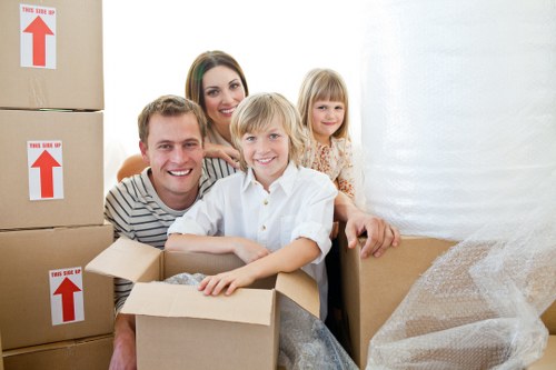 Packed boxes and furniture prepared for a flat move in Acton