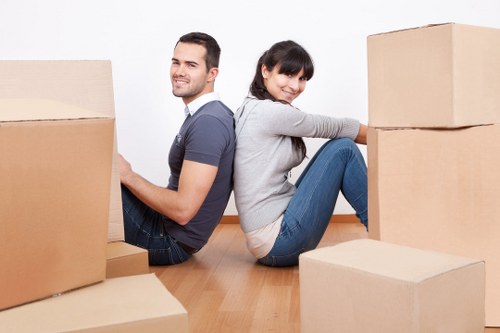 Local team collecting a sofa and chair from an Acton property