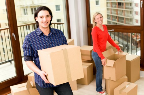 Local movers handling household furniture with care in Acton